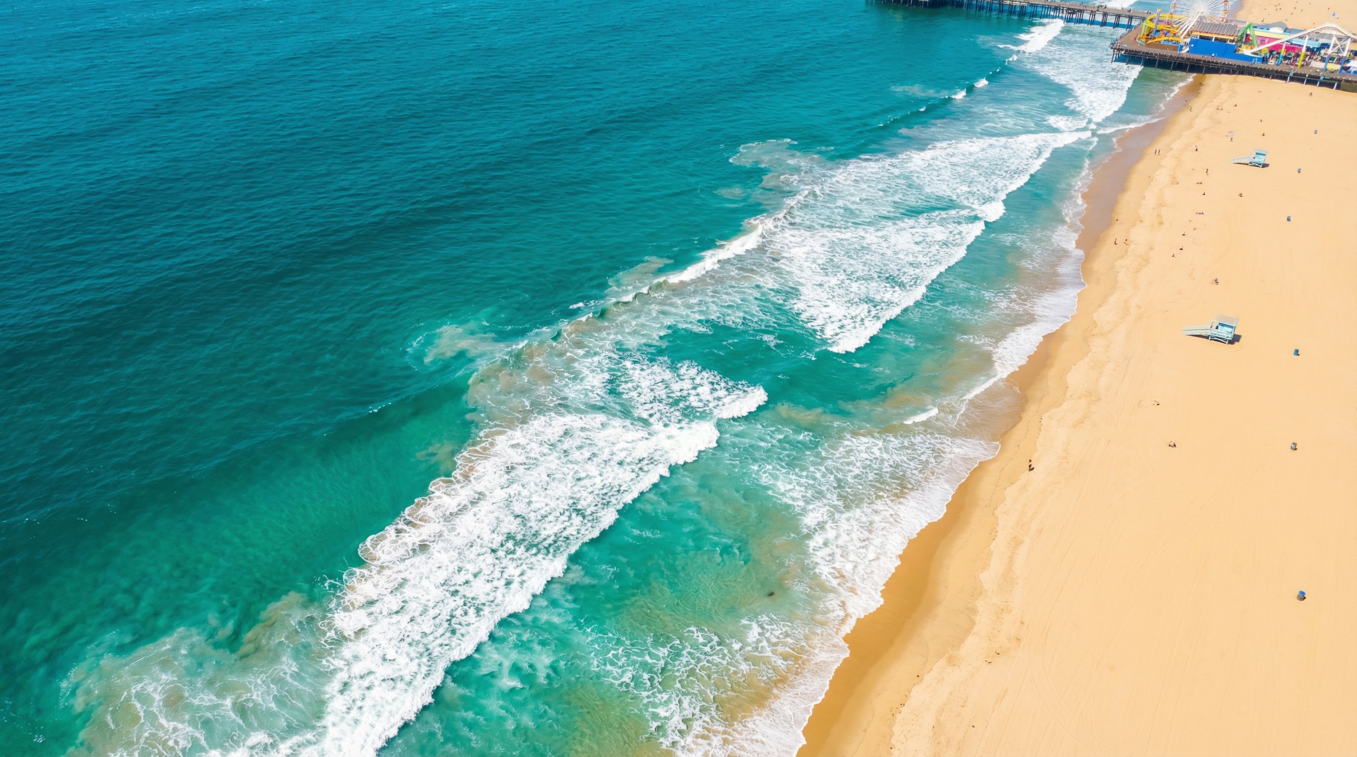 Aerial view of Santa Monica beach and turquoise ocean waves